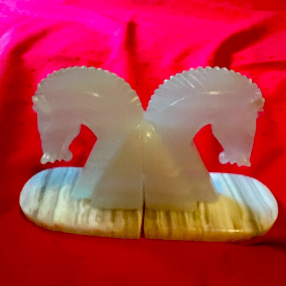 Sublimely matched onyx bookends feature Roman or Trojan Horses in cool shades
